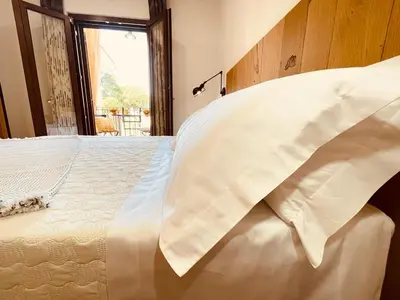 Letto o letti in una camera di B&B Dimora Dorgali