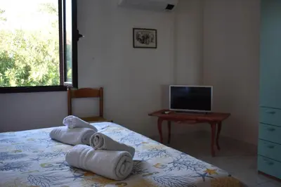 Letto o letti in una camera di Appartamenti San Teodoro