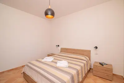 Letto o letti in una camera di Villetta Girgolu