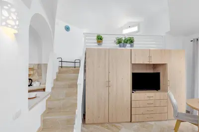 TV o dispositivi per l'intrattenimento presso Appartamento Smeralda - SHERDENIA Luxury Apartments