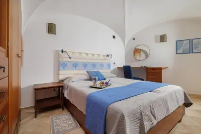 Letto o letti in una camera di Villetta Azzurro - SHERDENIA Luxury Apartments