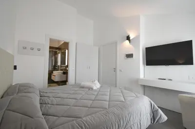 Letto o letti in una camera di CAVOUR ROOMS