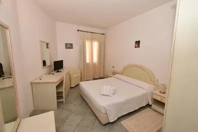 Letto o letti in una camera di Hotel Cavour