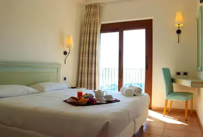 Letto o letti in una camera di Hotel Brancamaria