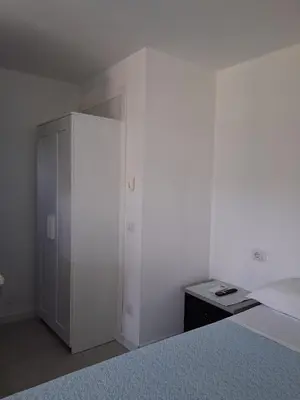 Letto o letti in una camera di Casa Marta