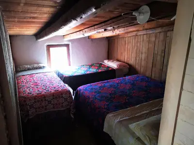 Letto o letti in una camera di Pinnettu sardo casa di campagna in ecosistema insetti e animaletti simpatici in condivisione,Leggere attentamente Prima di prenotare
