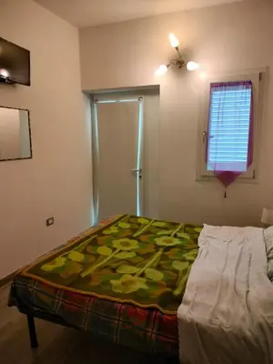 Letto o letti in una camera di Stella Marys Sud