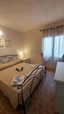 Letto o letti in una camera di Donnigheddu