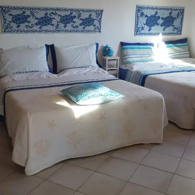 Letto o letti in una camera di GIARDINO DEL SOLE