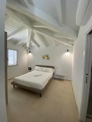Letto o letti in una camera di Villa Lorisa