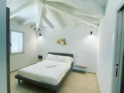 Letto o letti in una camera di Villa Lorisa