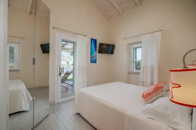 Letto o letti in una camera di Case al mare di Cala Saccaia