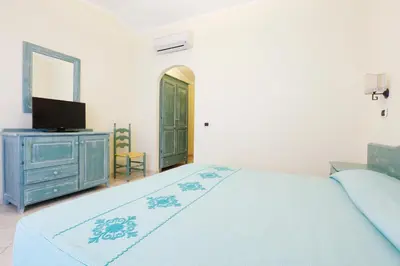 Letto o letti in una camera di Hotel Baia Aranzos