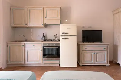 Cucina o angolo cottura di Le Residenze Del Golfo Di Orosei Bilo 5 - Happy Rentals