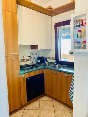 Cucina o angolo cottura di Villetta con giardino a due passi dal Mare - 6 posti letto - Porto Taverna