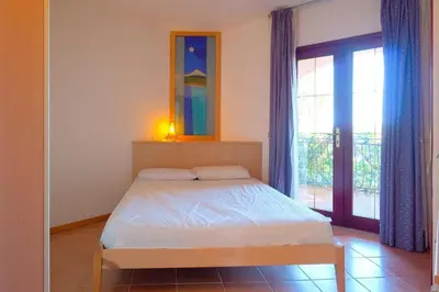 Letto o letti in una camera di Schiera La Primula