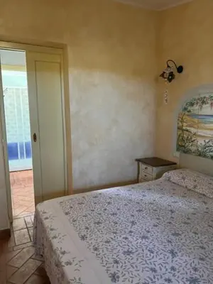 Letto o letti in una camera di Orosei RE - Villa Samuela a 50 m dal mare
