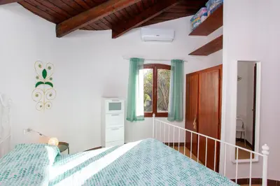 Letto o letti in una camera di Villa Smeralda