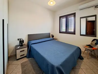 Letto o letti in una camera di Appartamento Trilocale vicino al centro di San Teodoro
