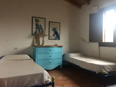 Letto o letti in una camera di Sunny House a Punta Molara