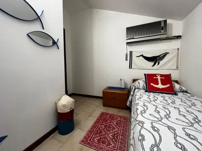Letto o letti in una camera di Cala Gonone Holiday Flats