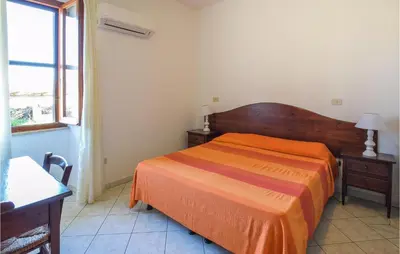 Letto o letti in una camera di 1 Bedroom Pet Friendly Home In Orosei