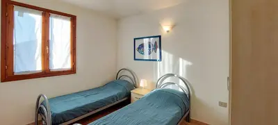 Letto o letti in una camera di Appartamento Residenziale Trilocale Aresula San Teodoro
