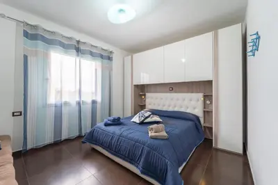 Letto o letti in una camera di Appartamento moderno a 500 MT dalle sabbie bianche