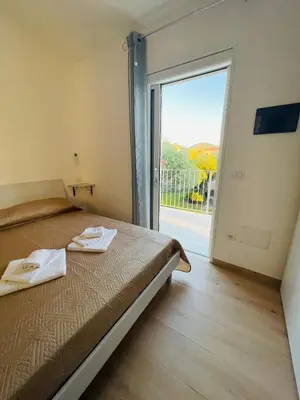 Letto o letti in una camera di CHRISSO ROOMS affittacamere
