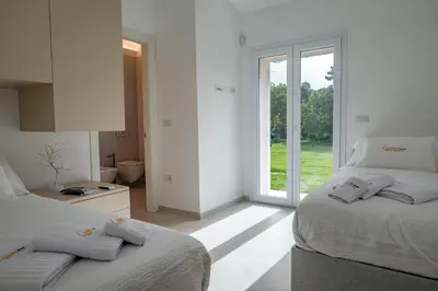 Letto o letti in una camera di Golden Root San Teodoro