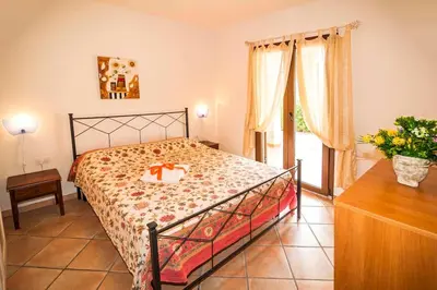 Letto o letti in una camera di residence lu soli budoni affitti