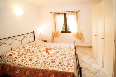 Letto o letti in una camera di residence lu soli budoni affitti