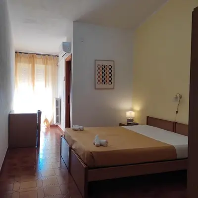 Letto o letti in una camera di Piccolo Hotel Nuova gestione