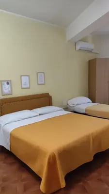 Letto o letti in una camera di Piccolo Hotel Nuova gestione