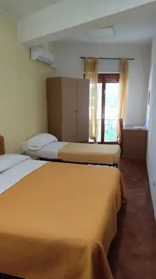 Letto o letti in una camera di Piccolo Hotel Nuova gestione