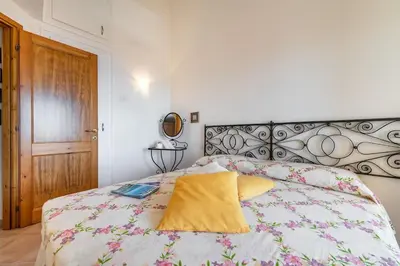 Letto o letti in una camera di AffittaSardegna-Casa Del Golfo