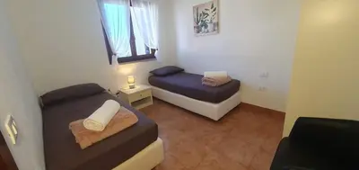 Letto o letti in una camera di Casa Laura