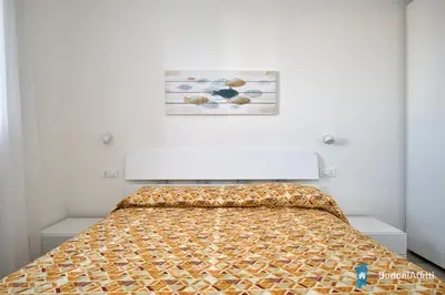 Letto o letti in una camera di Villetta indipendente al centro di BudoniAffitti