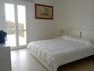 Letto o letti in una camera di Sea & Country Rooms Porto Rotondo Golfo Aranci