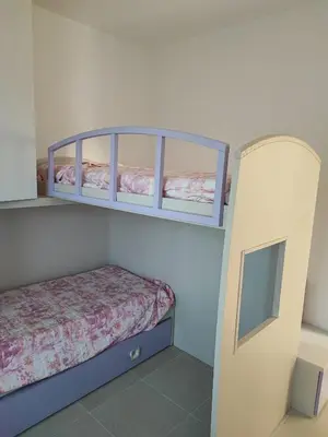 Letto o letti in una camera di Villetta Baia 1