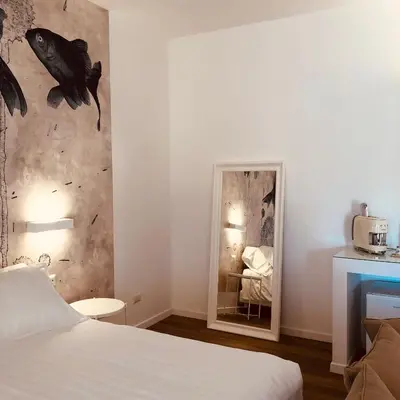 Letto o letti in una camera di Il Borgo Boutique Rooms by KasaVacanze