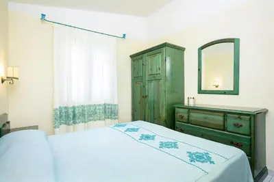 Letto o letti in una camera di Nicolaus Club Quattro Lune Resort