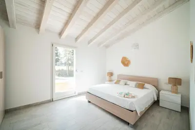 Letto o letti in una camera di Villetta 5 La Caletta