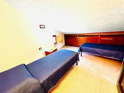 Letto o letti in una camera di Appartamenti San Teodoro I - II