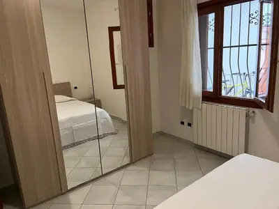 Letto o letti in una camera di Ampio bilocale