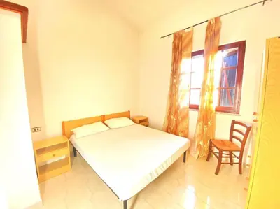Letto o letti in una camera di Casa Trentino 2
