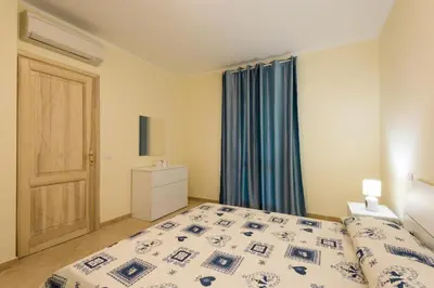Letto o letti in una camera di Le Perle Di Golfo Aranci