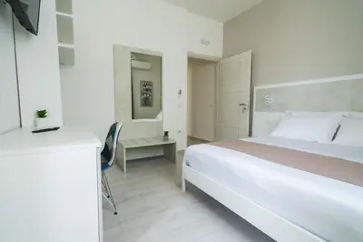 Letto o letti in una camera di VeMi Affittacamere