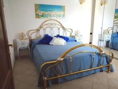 Letto o letti in una camera di Villa Liberty Budoni