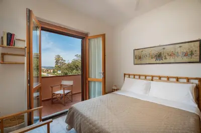 Letto o letti in una camera di Casa Rosella by Wonderful Italy